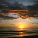 A person walking on the beach during sunset on July 16, 2007 in Marco Island, Florida